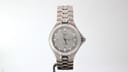 Front view of the Tissot T660 titanium watch, showing the grey dial with red accents and integrated silver bracelet on a white background.