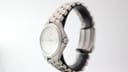 Side view of the Tissot T660 titanium watch, showing the curved case profile and the integrated bracelet design.