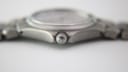 Extreme close-up of the fluted crown of the Tissot T660 watch, featuring the engraved Tissot 'T' logo.