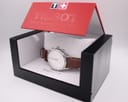 The Tissot T063617A watch carefully presented inside its original red and black manufacturer's box.