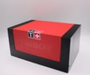 Closed view of the original Tissot red and black presentation box with the brand logo clearly visible.