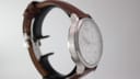 Side view of the Tissot T063617A case showcasing the brushed and polished finishes and subtly curved lugs.