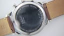 Close-up of the stainless steel case back with engravings for model T063617A, serial, water resistance, and sapphire crystal.