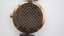 Close-up of the Gucci 141.4 case back, showing engravings: 'GUCCI', 'STAINLESS STEEL', 'SWISS MADE', 'WATER RESISTANT 5 ATM', '141.4', and serial '16303326'.