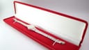 The Seiko 11-0630 watch resting inside a generic red presentation box.