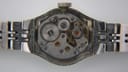 Open case back view of the Seiko 11-0630, revealing the manual wind mechanical movement components.