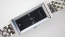 Gucci 127.5 ladies quartz watch with rectangular stainless steel case, black dial, diamond markers, and steel bracelet photo 2