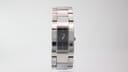 Angled view of the rectangular black dial Gucci watch with silver steel bracelet.