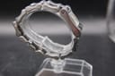 Another side view of the Gucci 2305L watch bracelet and case, highlighting the integrated link construction and polished finish from a different angle.