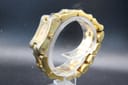 Back-left three-quarter view of the Gucci 2305L, showcasing the unique sculptural screw-link integrated gold-tone bracelet.