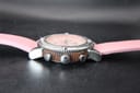 Side view of the watch case, highlighting the ridged brown mid-case, screw-down crown with 'F' logo, and chronograph pushers.