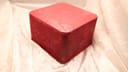 Top view of the closed rectangular red Omega presentation box.