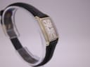 Angled view of the Omega Geneve watch on a display stand, highlighting the rectangular case.