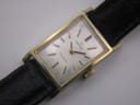 Close-up of the Omega Geneve's white rectangular dial, displaying the Omega logo and Geneve text.