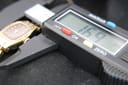 Close-up of digital calipers measuring the watch case, displaying "16.9 mm".