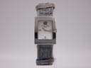 Front view of the Christian Dior D78-109 watch, highlighting the polished silver rectangular case, mother of pearl dial with Arabic 12, and denim-style strap.