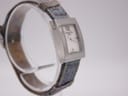 Another side profile view of the Christian Dior D78-109 watch, focusing on the case curves and the texture of the denim-style strap.