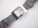 Angled front view of the Christian Dior D78-109 watch, showcasing the dial and the blue fabric strap.