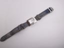 Full length overhead view of the Christian Dior D78-109 watch, displaying the entire blue fabric strap from the front.