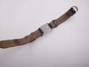 Full length overhead view of the Christian Dior D78-109 watch from the rear, showing the worn brown leather lining of the strap.