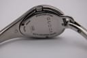 Close-up of the watch case back, showing 'GUCCI', 'STAINLESS STEEL', 'SWISS MADE', '103', '10228756', and 'WATER RESISTANT 3 ATM'.