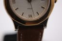 Macro close-up of the bottom part of the Tissot PRX dial, revealing 'PRX' and 'P 440 SWISS-T' markings.