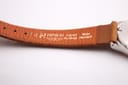 Close-up of the inner side of the Hirsch Camelgrain leather strap, with '14', 'HIRSCH', 'Camelgrain', 'No Allergy', and 'Water Resistant' markings.