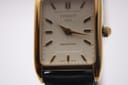 Detailed close-up of the Tissot T815 Fascination dial, showing 'TISSOT 1853' and 'FASCINATION' text, with gold hands.