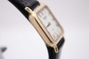 Another close-up side view of the Raymond Weil 5748 watch, showing the rectangular case profile and the textured black leather strap.
