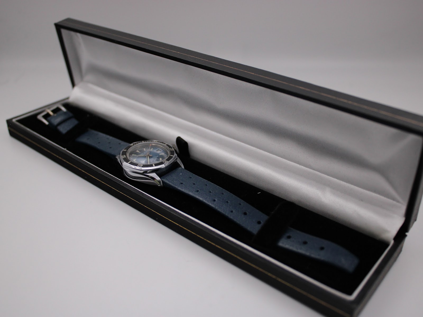 The Marine Star Tropic Star watch resting inside an open black and white presentation box, ready for gifting or storage.