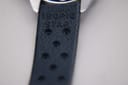 Close-up of the dark blue Tropic-style rubber strap, showing "14mm TROPIC STAR" embossed text.