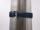 Close-up of the dark blue rubber strap on a wrist sizing cone, showing it buckled at approximately 155mm / 15.5cm.