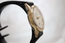 Another side view of the Services Marine watch on a display stand, focusing on the curved lugs and the case thickness.