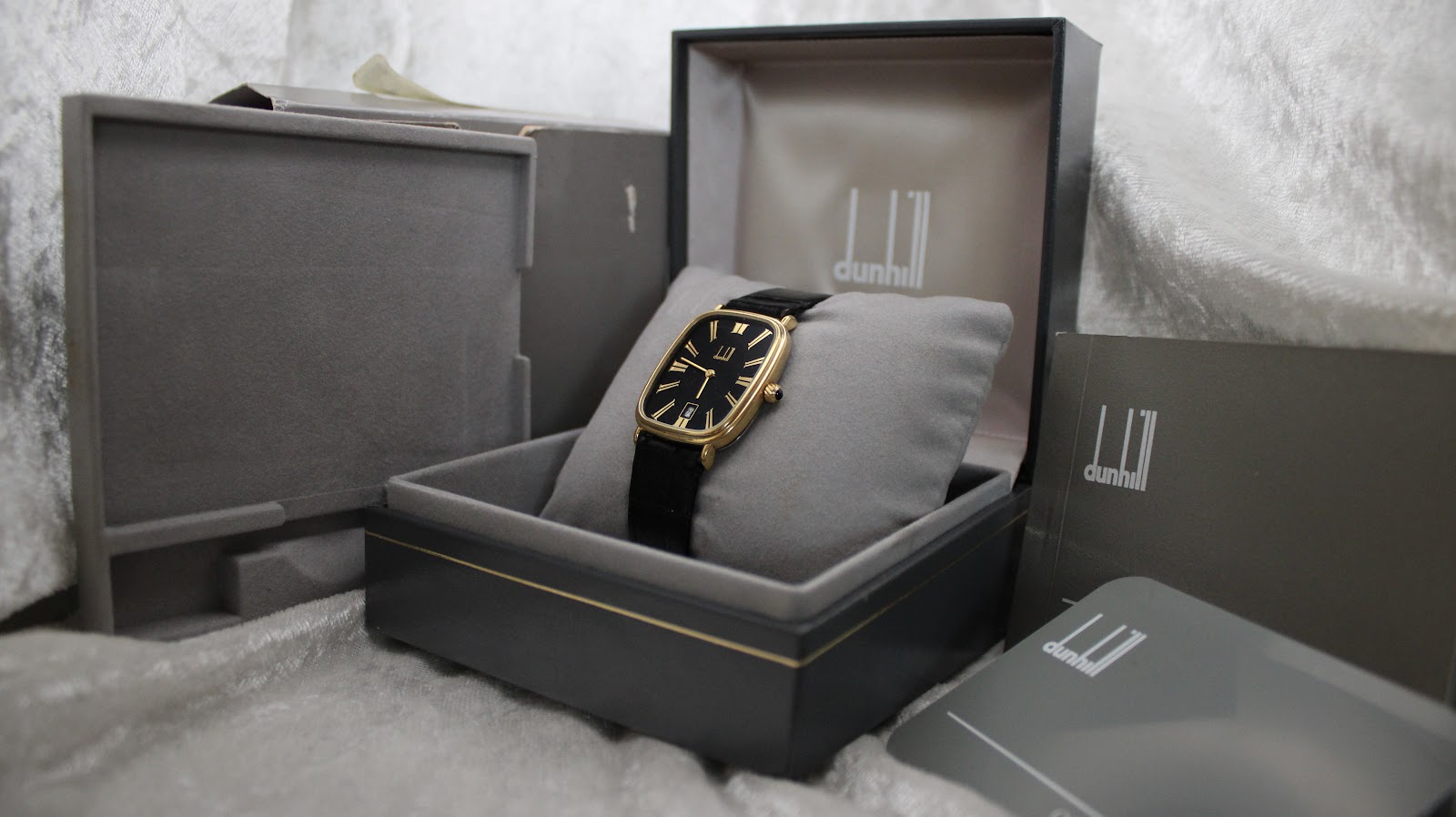 The Dunhill watch presented in its original dark grey presentation box.