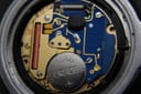 Internal view of the watch's Swiss quartz movement with a Duracell battery.