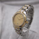 Detailed front-angled view of the Gucci 8040M, highlighting the two-tone bracelet and dial.