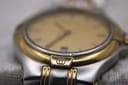 Macro shot of the lug detailing and the champagne dial with date window.