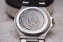 Rear view of the Gucci 8040M case back, displaying the embossed Gucci crest and engravings.