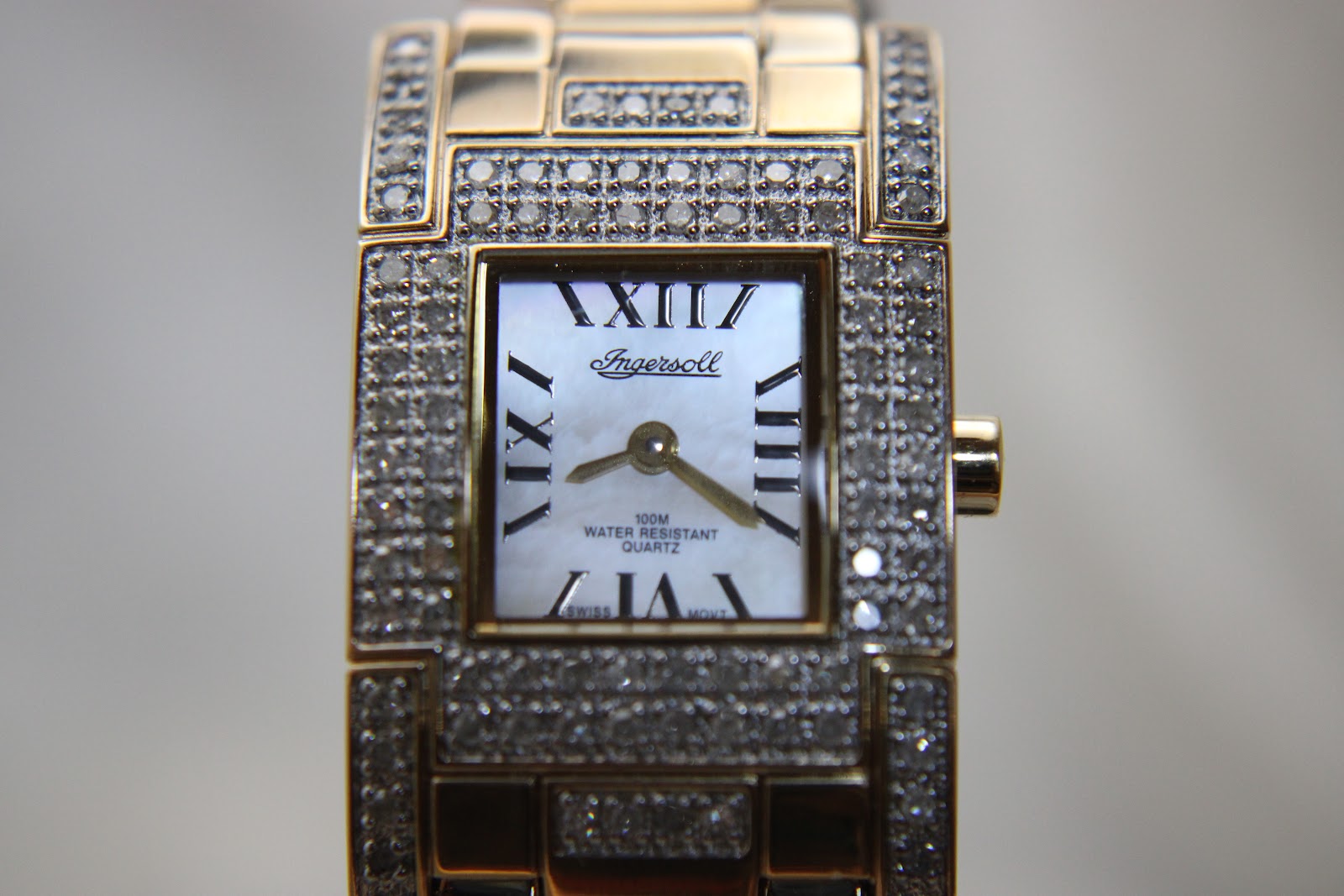 Close-up of the Ingersoll Diamond watch dial, showing the brand logo, Roman numerals, and mother-of-pearl texture.