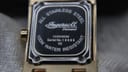 Detailed view of the watch case back, engraved with Ingersoll, model IG0036DM, serial number, and water resistance details.