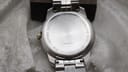 Rear view of the Tissot PR 100 stainless steel case back.