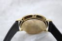 Side profile view of the Gucci 3000M case and crown, showing the detailed G logo on the crown.