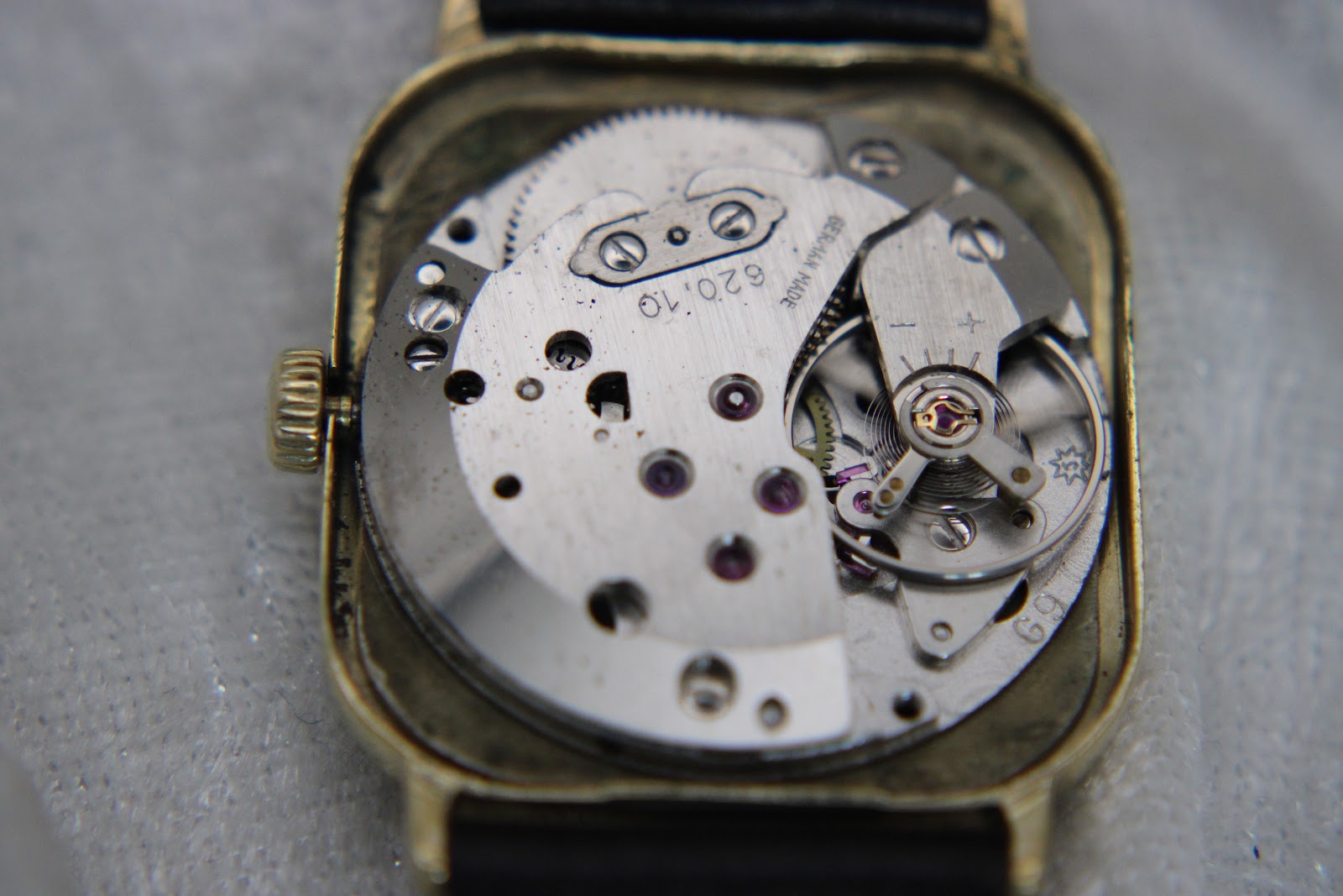 Close-up of the watch's manual wind movement, Junghans Calibre 620.10, showing jewels and 'German Made' inscription.