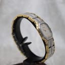 Front-left view of the Favre-Leuba Genève two-tone watch, showing the integrated bracelet and octagonal case.