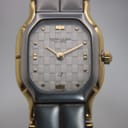 Close-up front view of the Favre-Leuba Genève watch dial, featuring a silver checkerboard pattern and gold-tone hands.