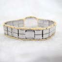 Rear view of the integrated two-tone metal bracelet with the hidden folding clasp closed.
