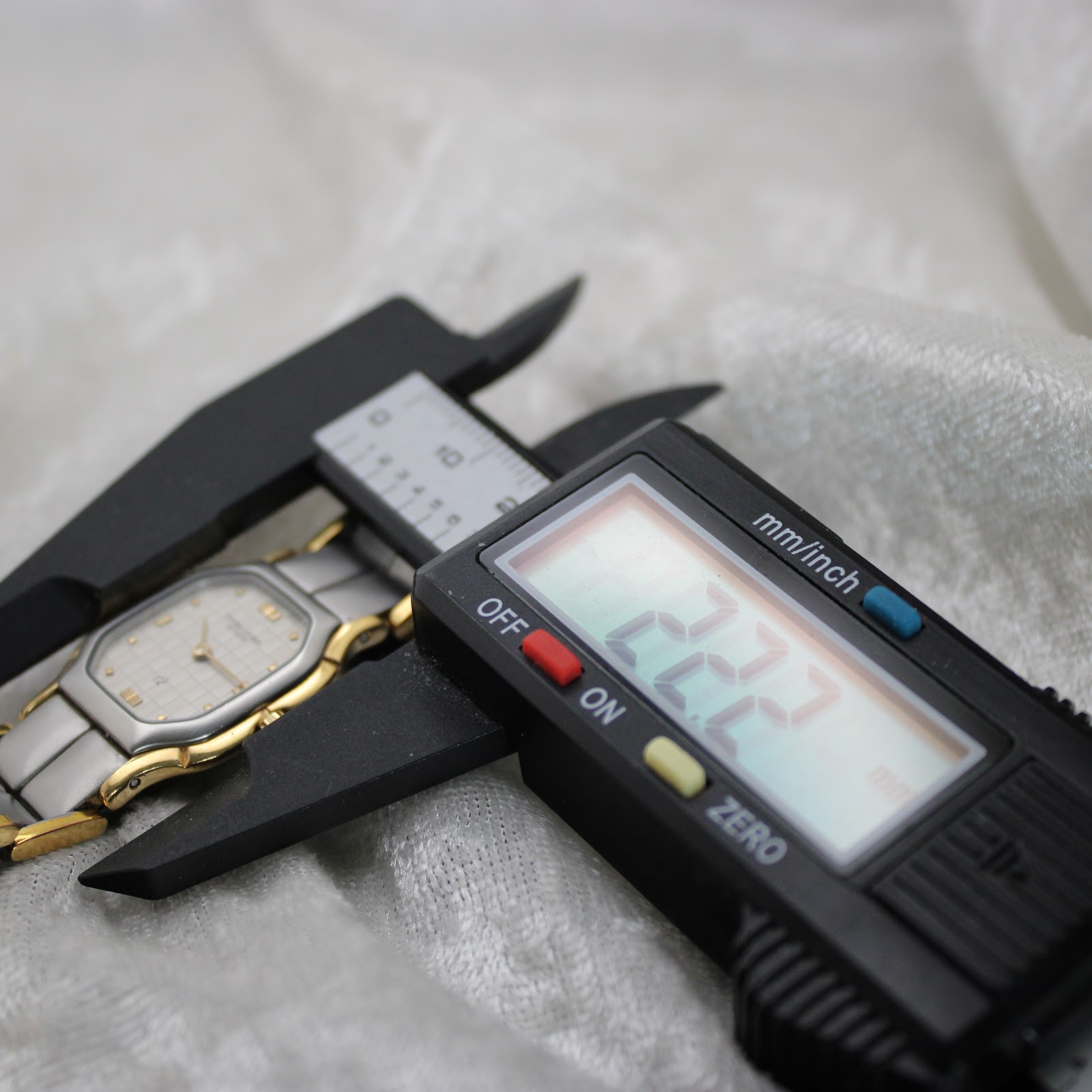 Digital caliper measuring the case diameter of the Favre-Leuba watch, displaying 22.2mm.
