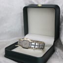 The Favre-Leuba watch resting inside an open dark green presentation box on a white background.