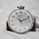 Oris pocket watch's polished side case and crown detail.