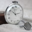 Vintage Oris pocket watch with its silver-tone metal chain.